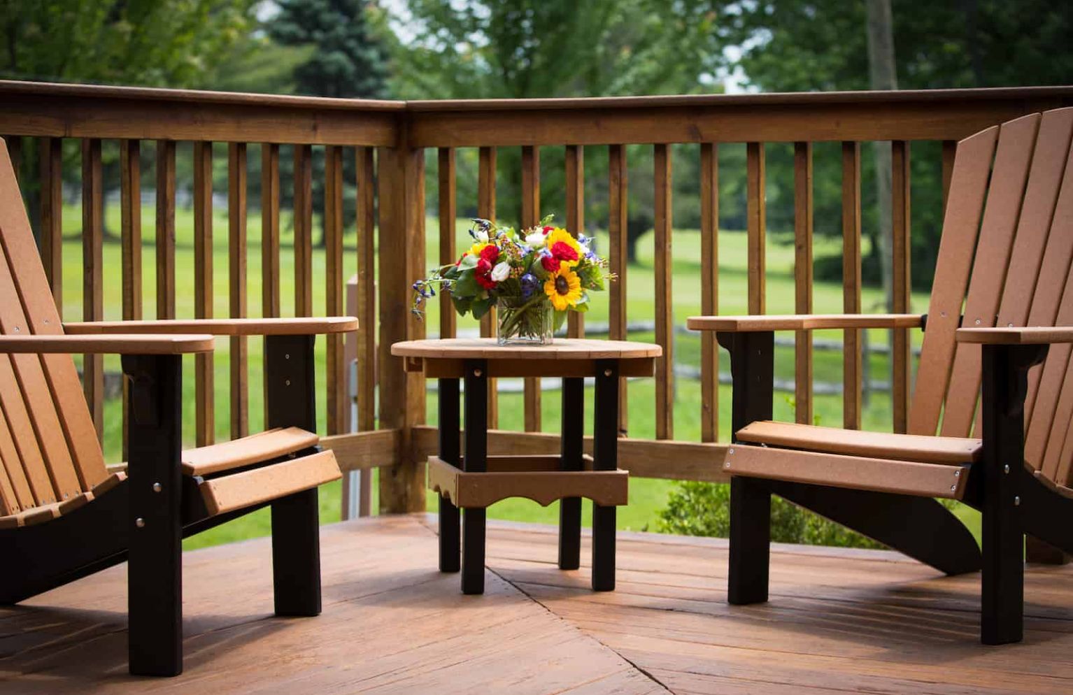 Gallery Image - porch with chairs and flower arrangement
