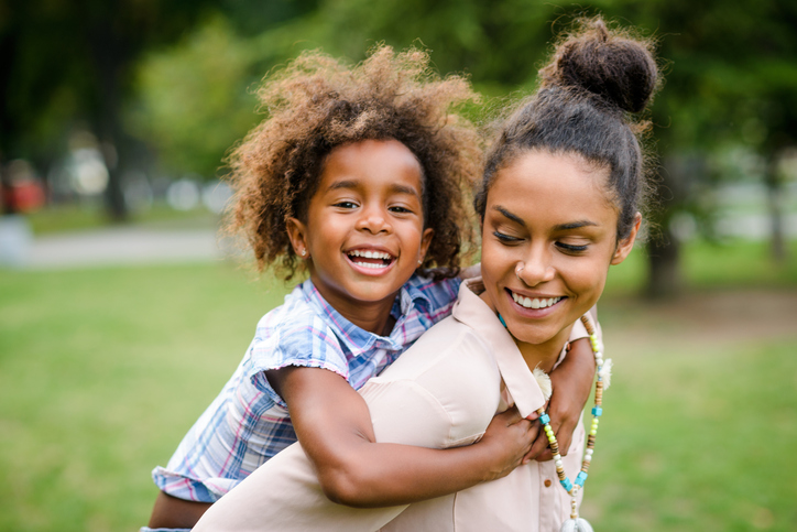 Mother and daughter having fun at the park