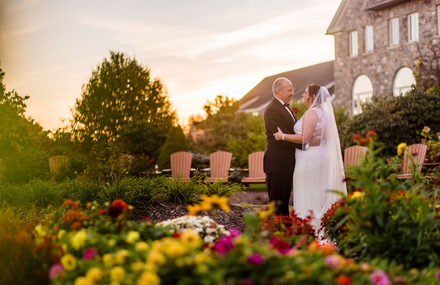 Gallery Image - bride and groom looking at each other in the sunset