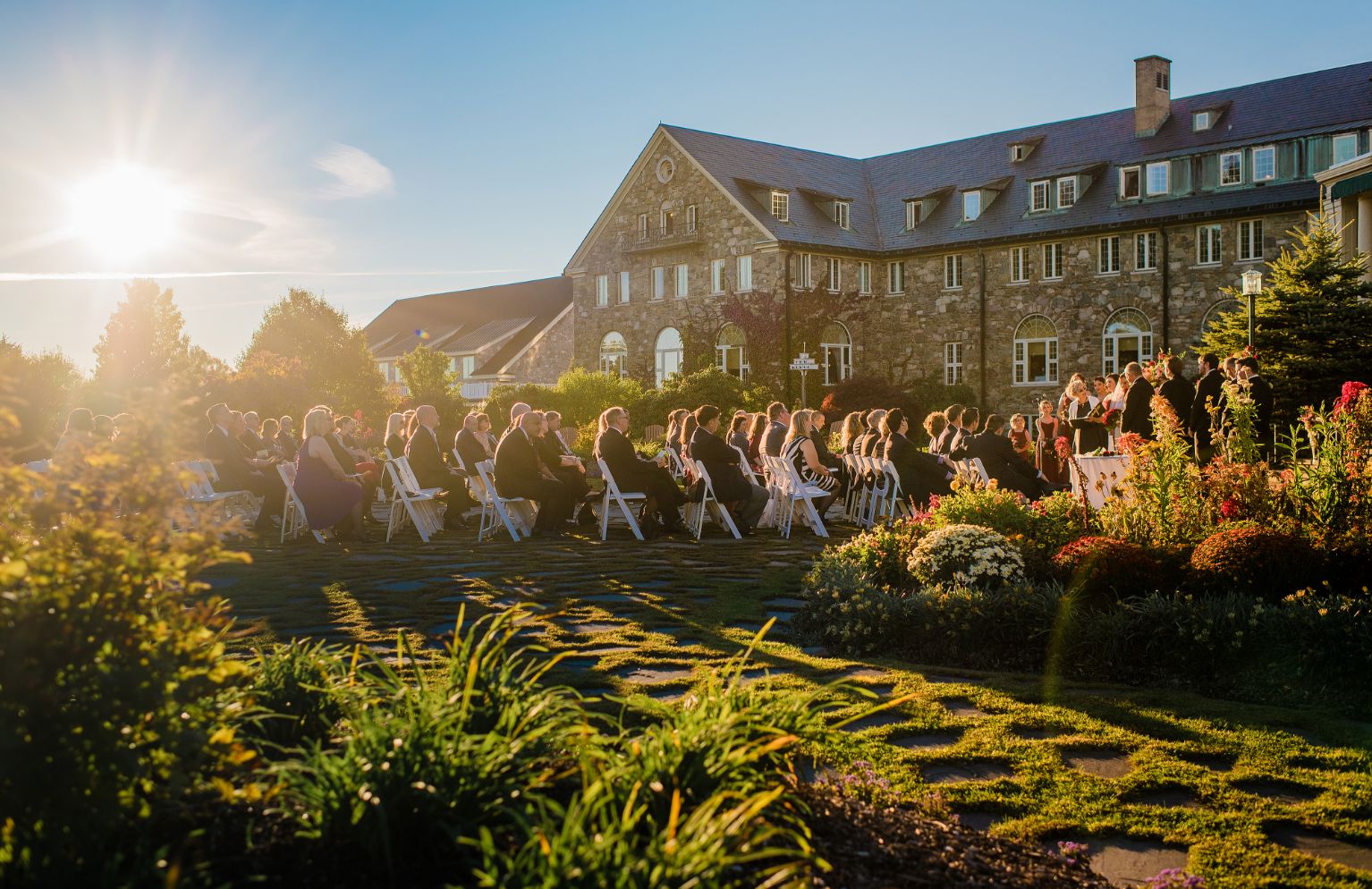 Gallery Image - wedding guests sitting at wedding ceremony